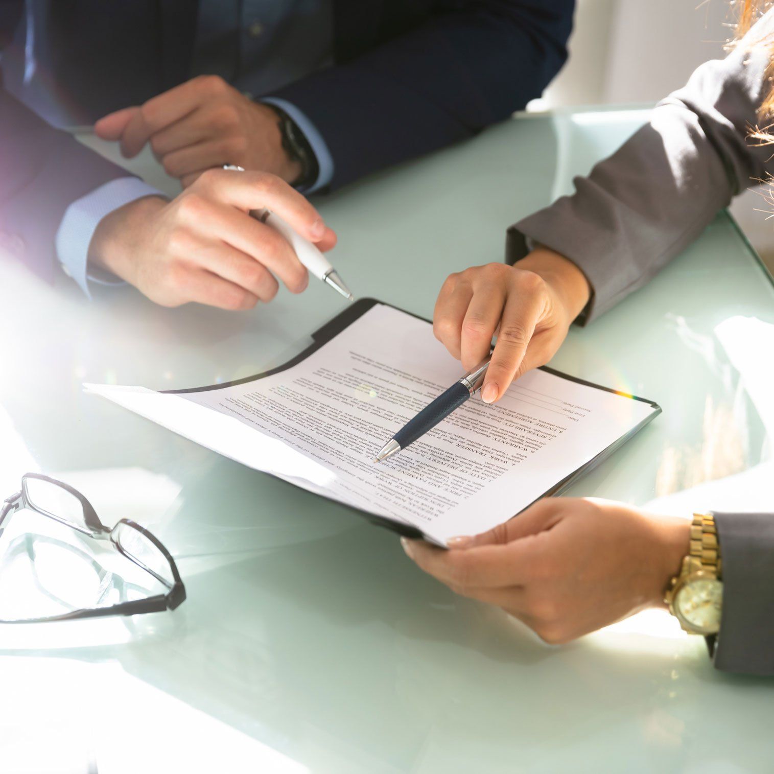 Reading Paper with Attorney — St. Joseph, MO — Ritchie, Soper & Schutt, LLC Estate Planning Lawyer