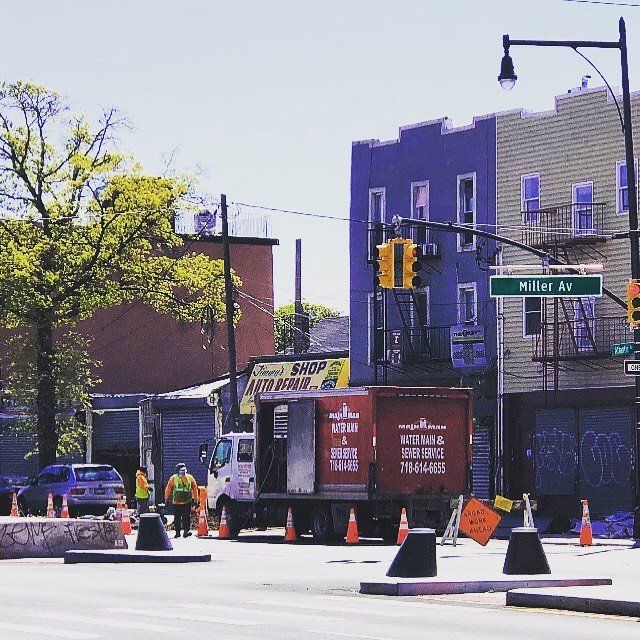 A street scene with a sign that says miller av