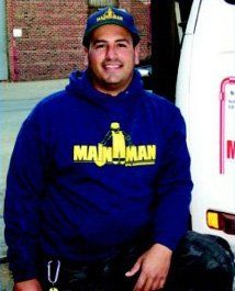 A man wearing a blue shirt that says madman