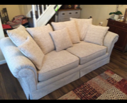 White sofa with matching cushions