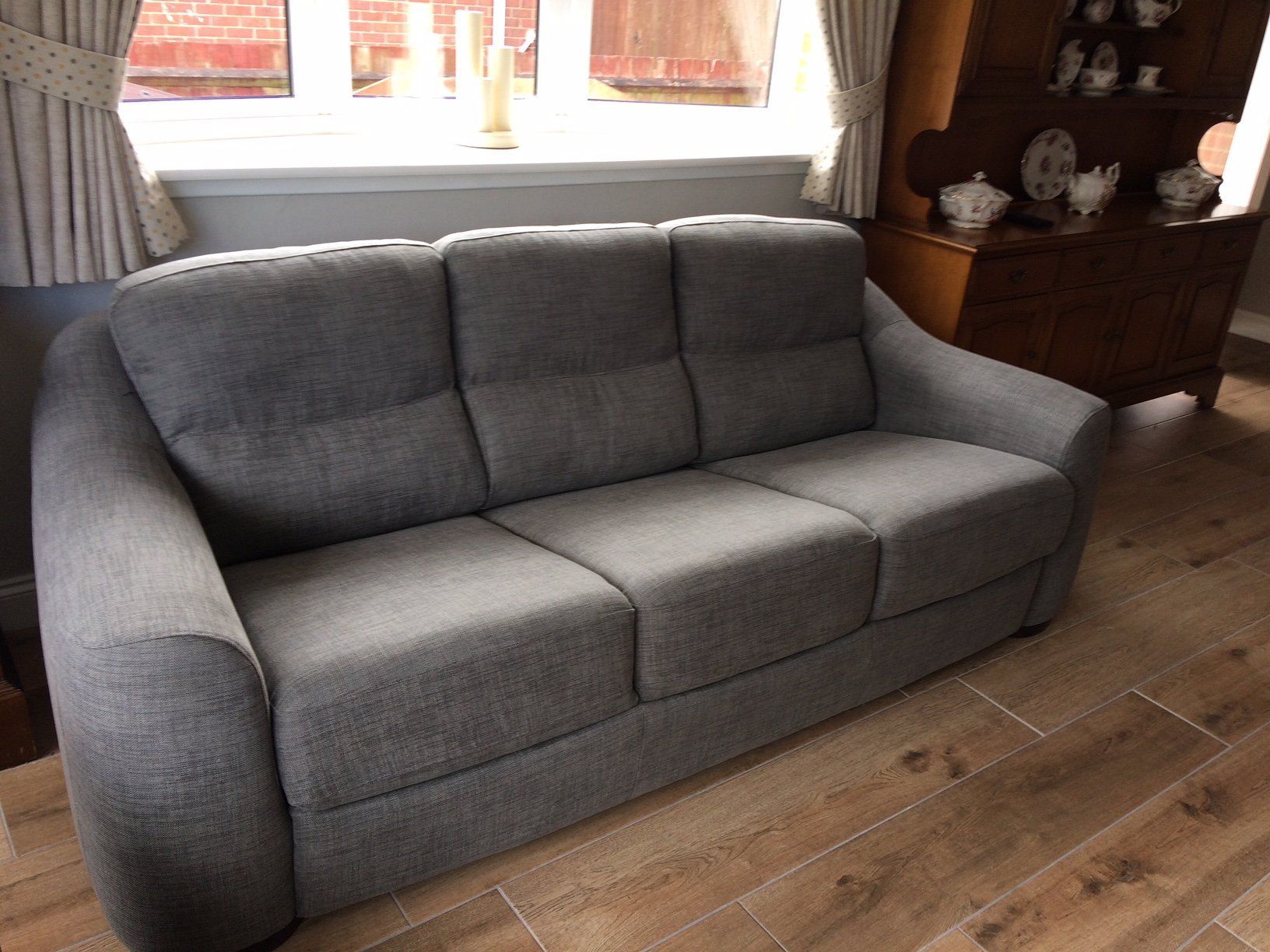 Blue sofa by window