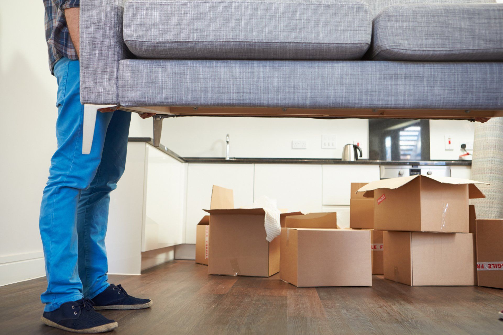 Moving Company — Movers Carrying Sofa in Morehead City, NC