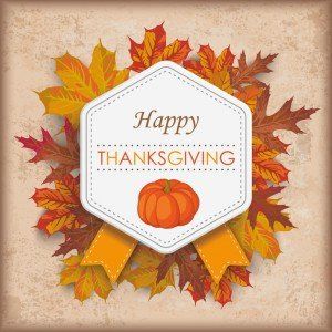 A happy thanksgiving card with a pumpkin and leaves