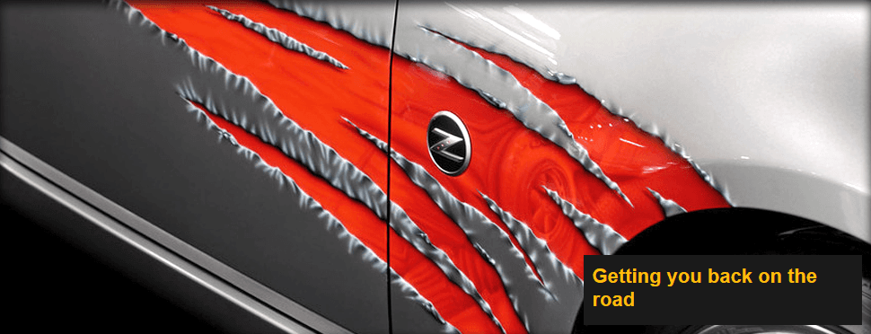 New paintwork on a car being revealed in strips