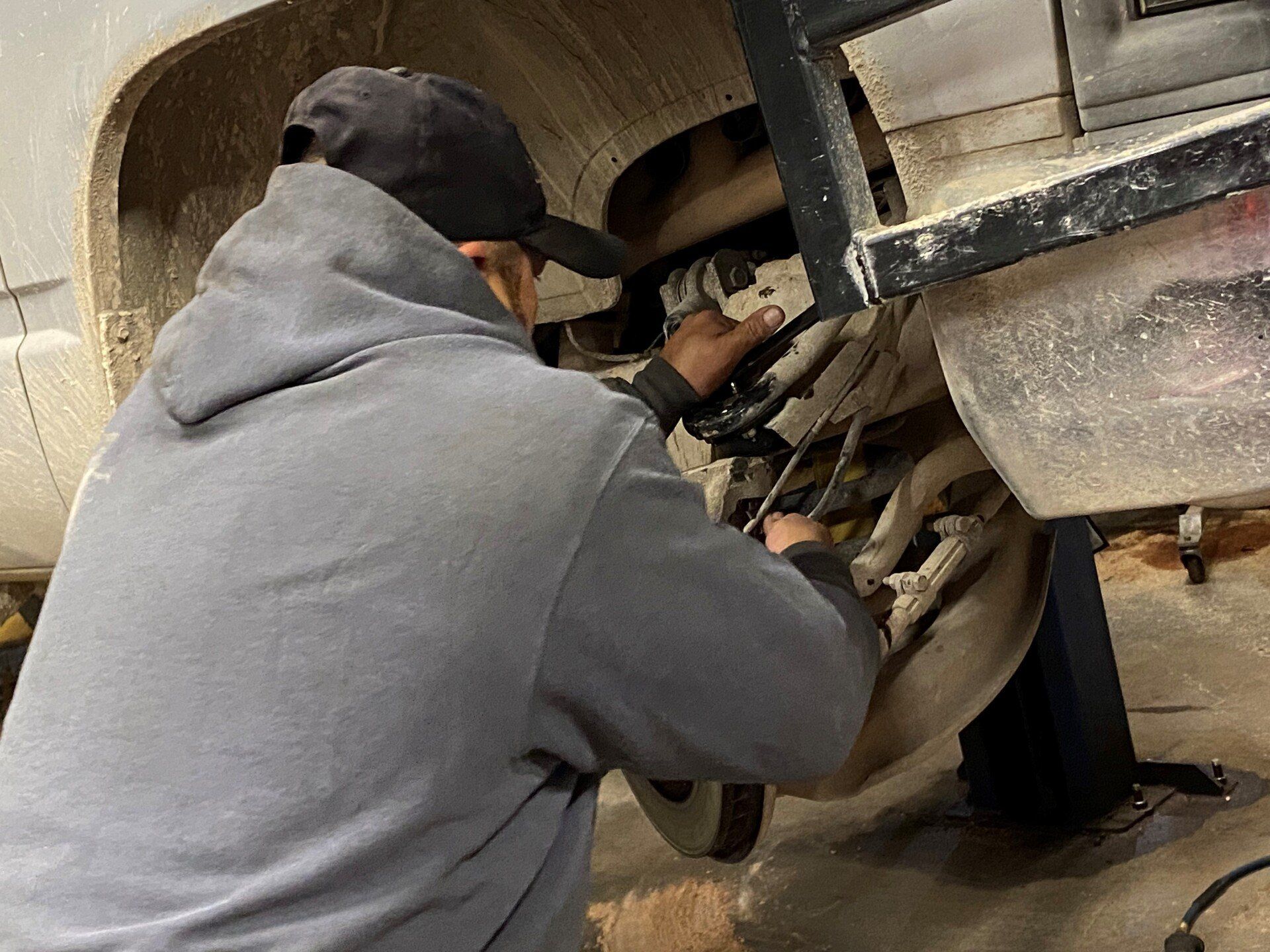 Mechanic Fixing Brake Gear — San Angelo, TX — Caddo Street Wheel Alignment & Brake Shop, Inc