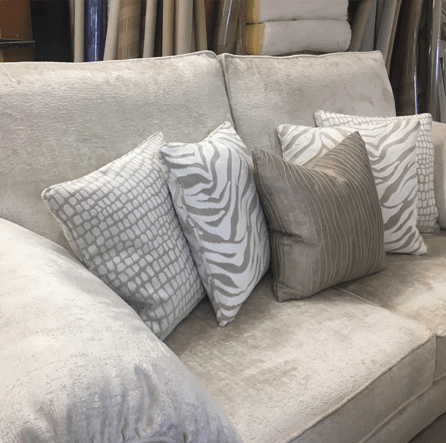 silver sofa with cushions