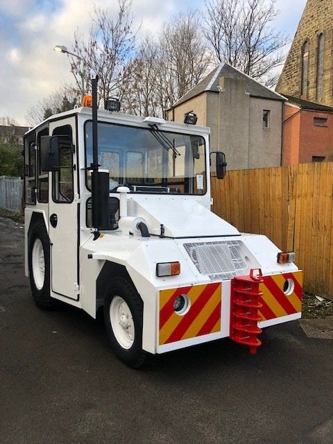 Refurbished white manual handling vehicle - front view