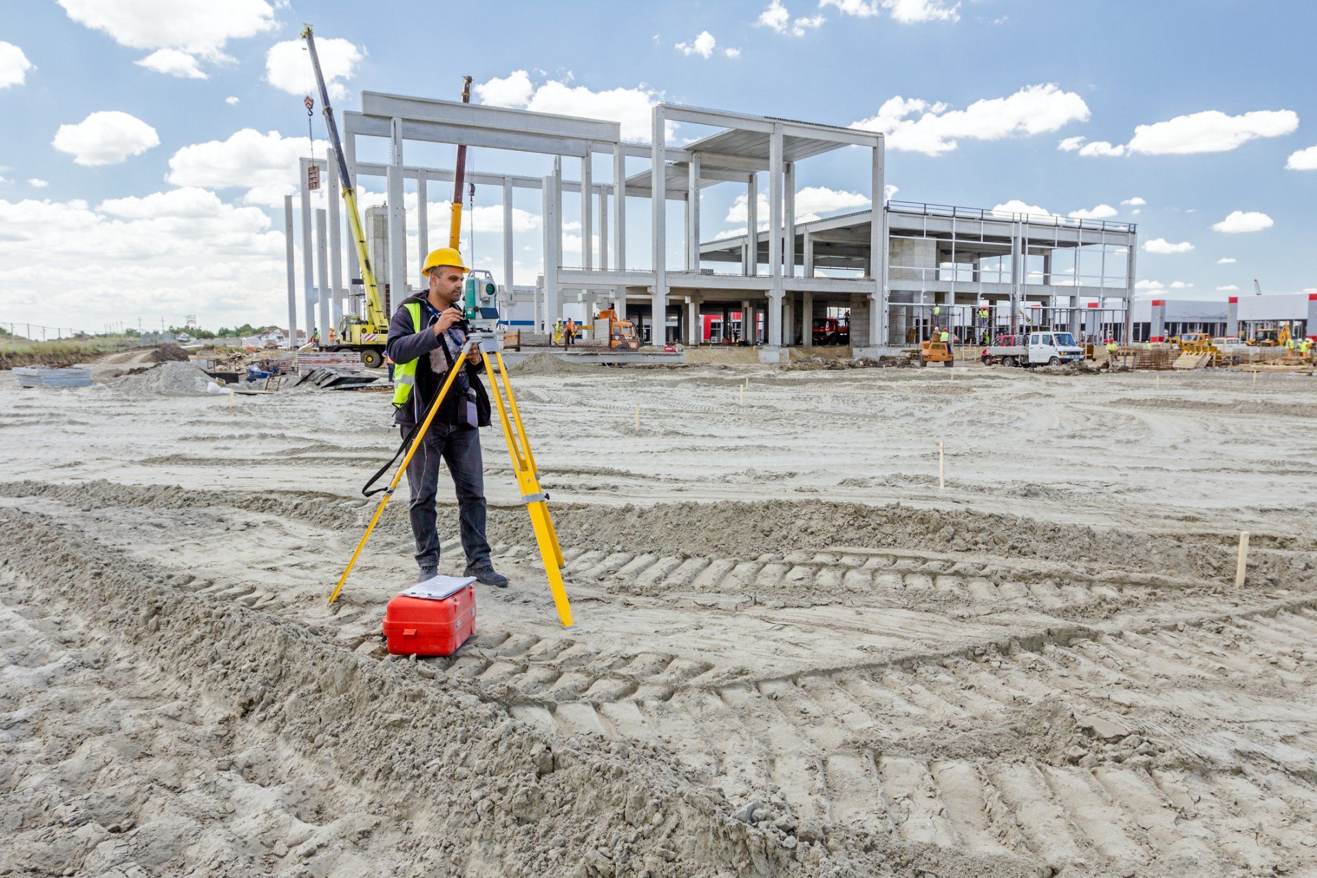 worker surveying land