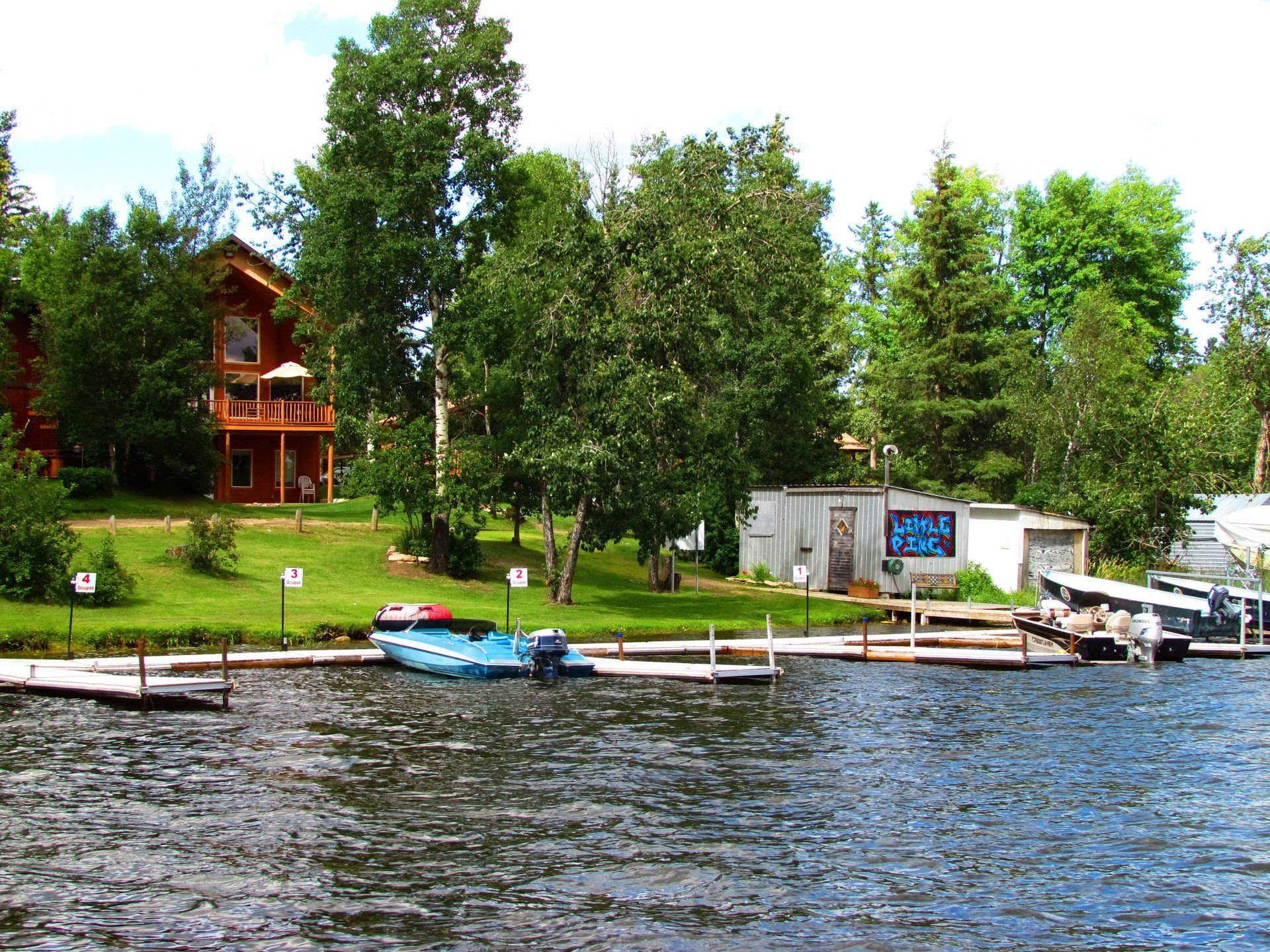 Photo of cabin shot while on a boat in the lake