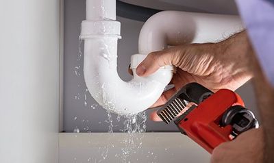 Plumber Fixing Sink Pipe — Spring Valley, CA — Infinity Plumbing & Construction Inc. Plumber Fixing Sink Pipe — Spring Valley, CA — Infinity Plumbing & Construction Inc.