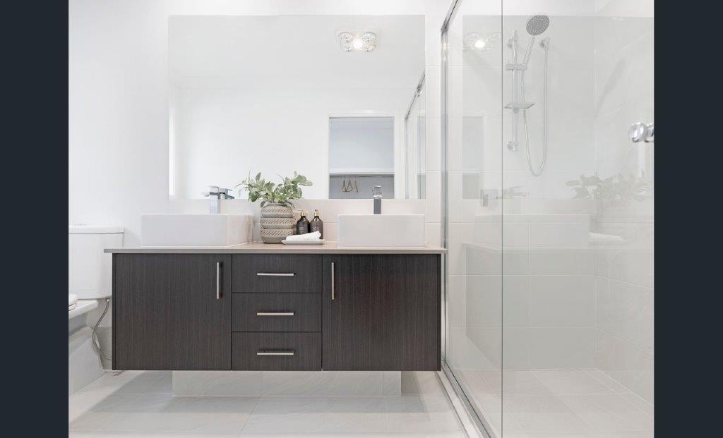 white bathroom with a black cabinet