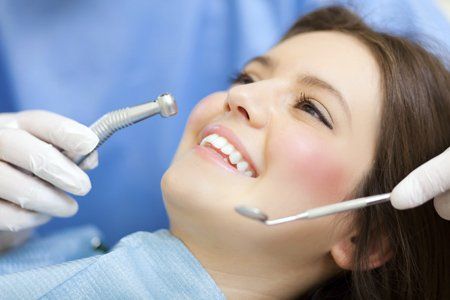 lady getting her teeth examined