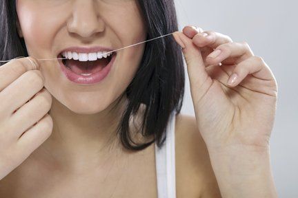 woman cleaning teeth woman cleaning teeth
