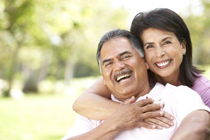 man and woman smiling with dentures man and woman smiling with dentures