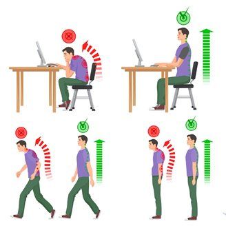 A man is sitting at a desk with a computer and a man is walking.