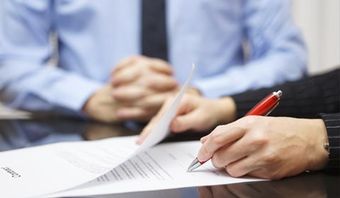 Man Writing — insurance adjusters in Albany, NY