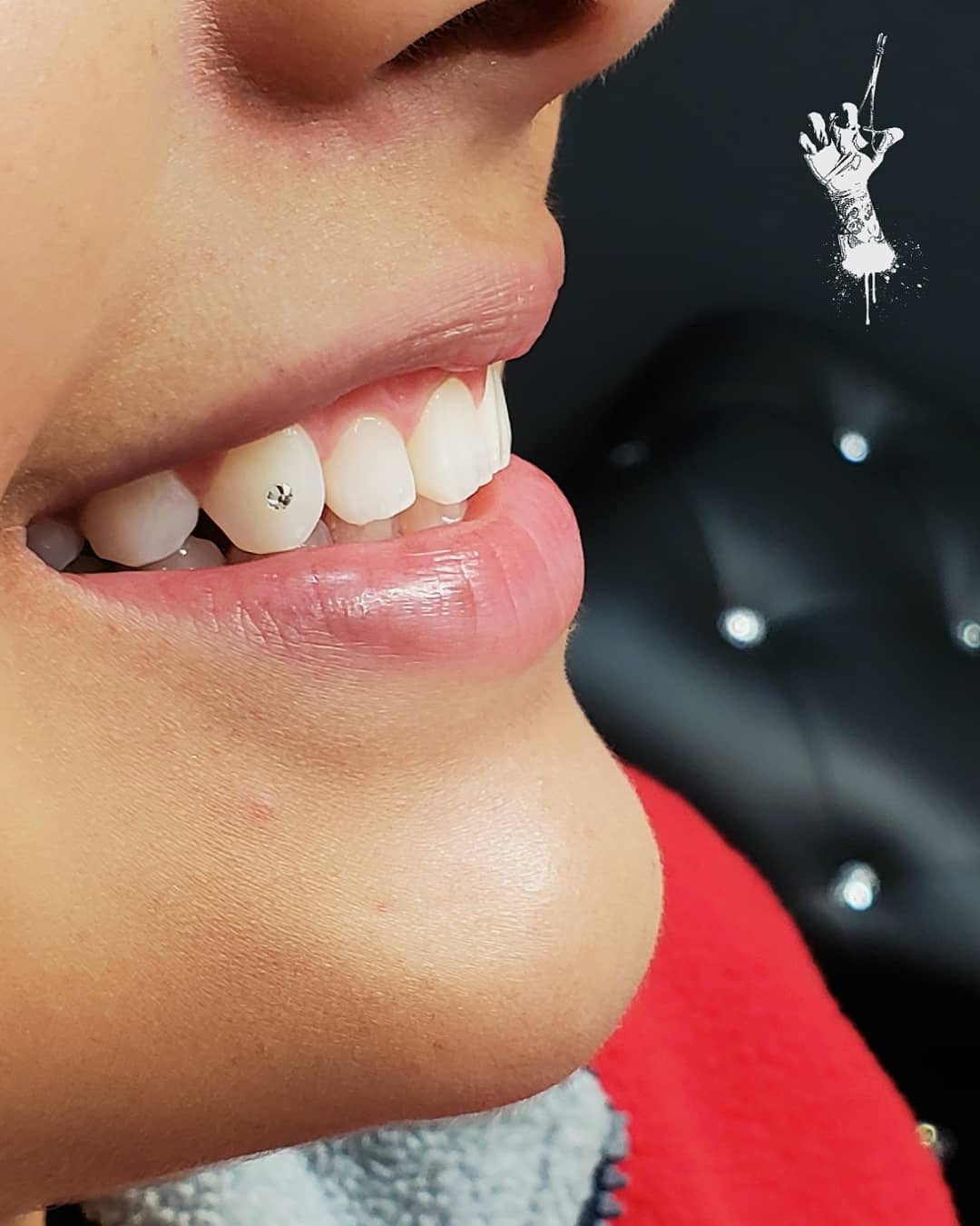 Tooth gem smile close-up at Ikonik Ink in Lakewood