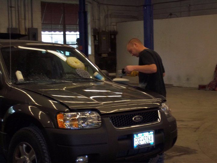man repairing car