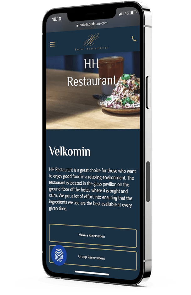A cell phone with a restaurant website on it.