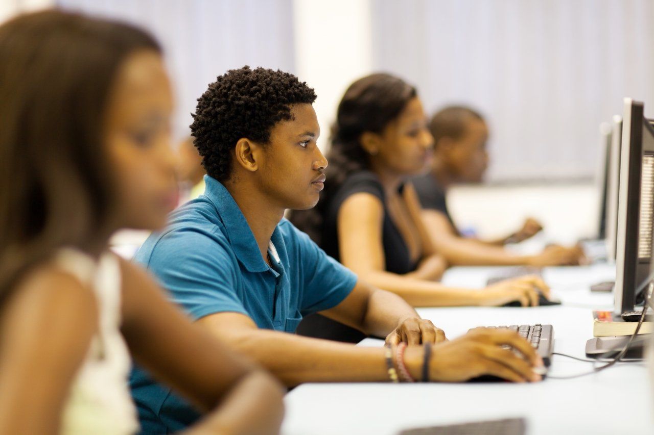Teens at the Portland Clubhouse doing school work