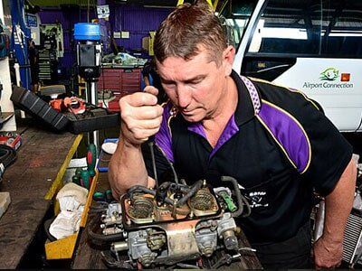 Mechanic Working on Engine — Motor Centre in Cairns, QLD Mechanic Working on Engine — Motor Centre in Cairns, QLD