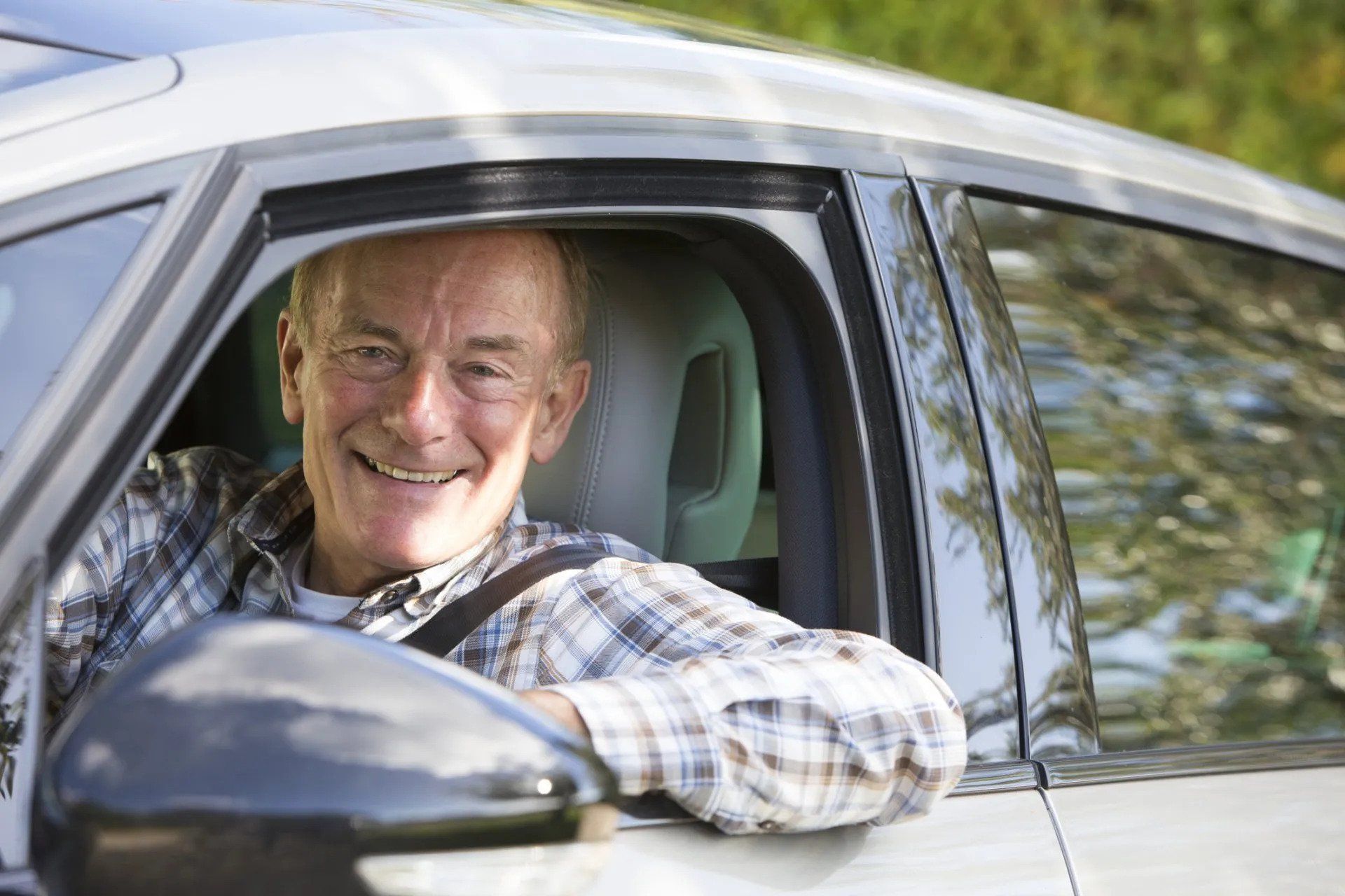 Senior Smiling While Driving — Tucker, Ga — Taggart's Driving School Senior Smiling While Driving — Tucker, Ga — Taggart's Driving School