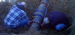 plumbers working on a pipe plumbers working on a pipe