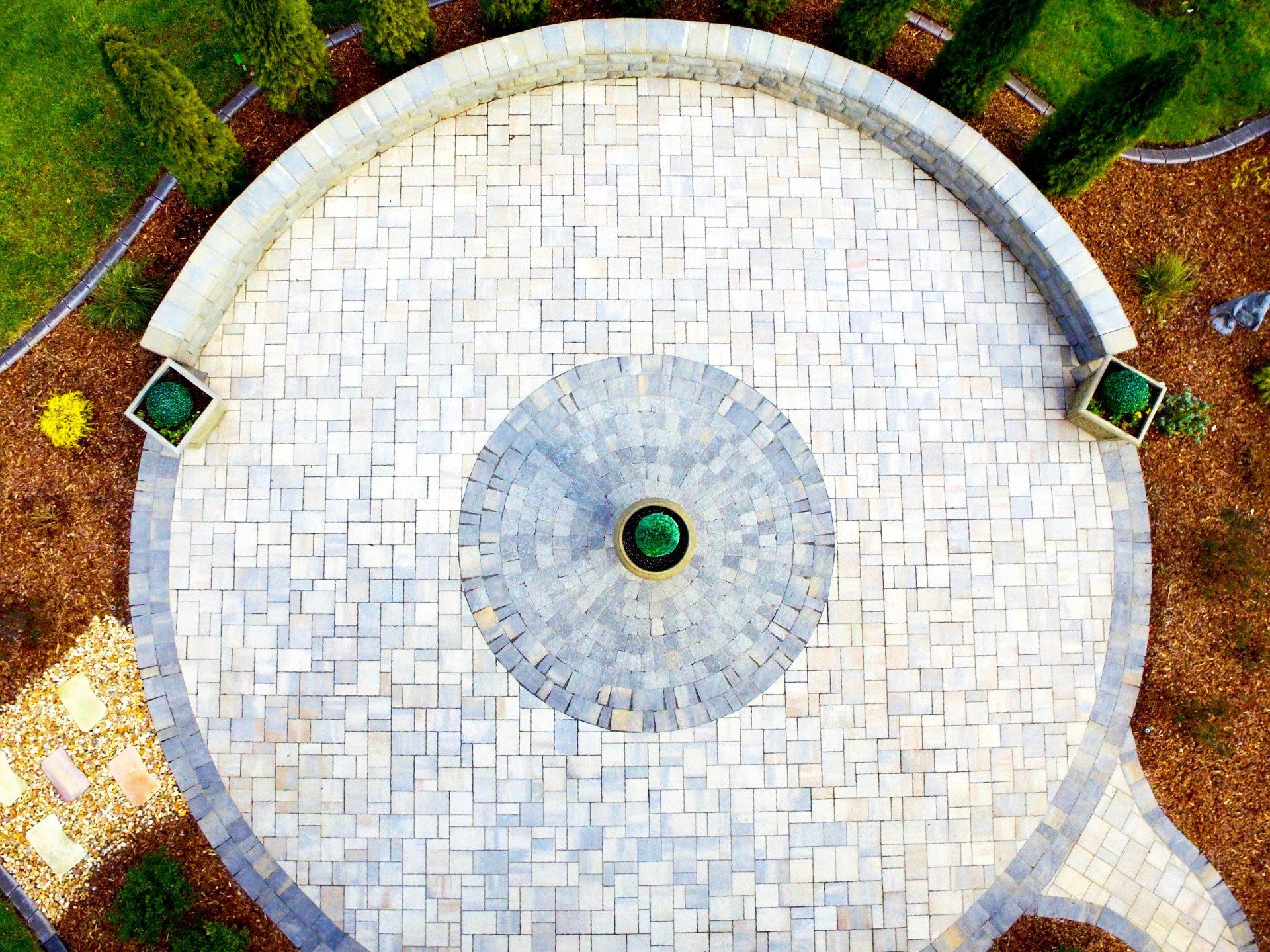 aerial shot of circular hardscape with landscaping surrounding