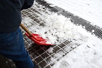 Snow Removal with Red Shovel — Lawn Care in Moseley, VA Snow Removal with Red Shovel — Lawn Care in Moseley, VA