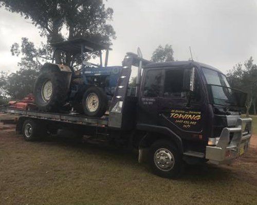 tractor in the tow truck