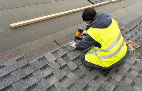 Roof Replacement — New Roof Under Construction in Kenner, LA