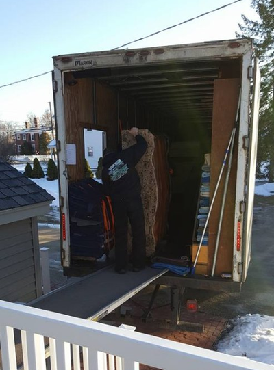 Loading Moving Truck — Truck Unloading Furniture in Manchester, NH Loading Moving Truck — Truck Unloading Furniture in Manchester, NH