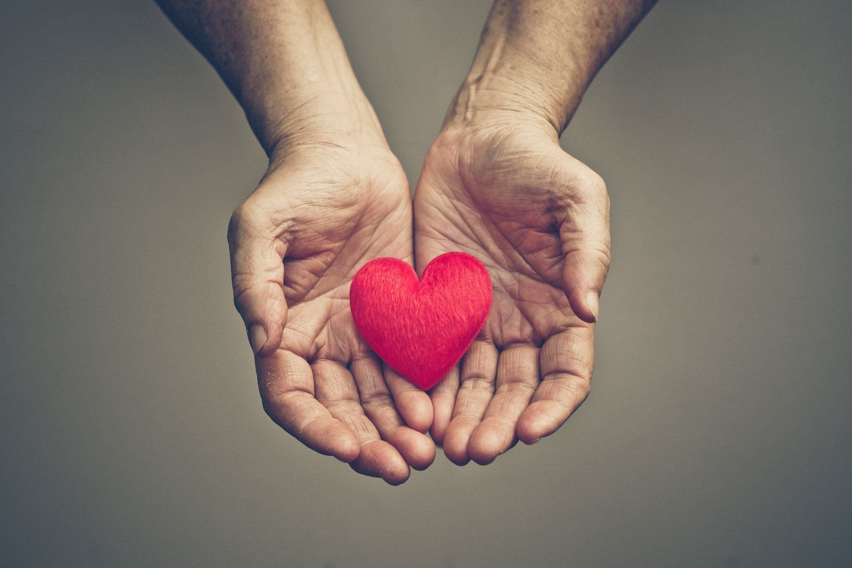 Hand holding hearts