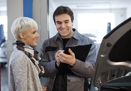 Young Woman And Mechanic — Auto Repair in Wellsville, PA Young Woman And Mechanic — Auto Repair in Wellsville, PA