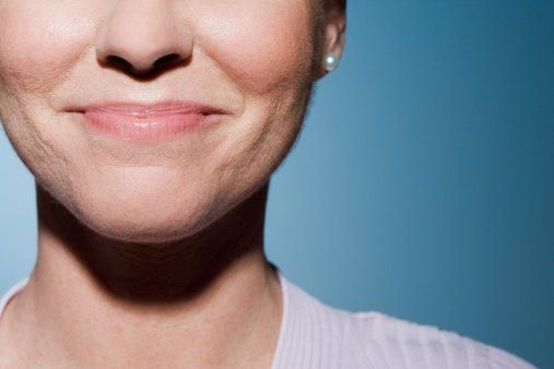 Facial pain and jaw joint problems closed smiling woman