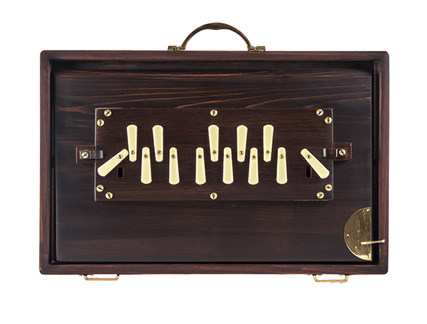 A wooden box with a handle and a few keys on it
