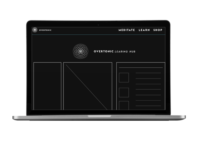A laptop computer is open to a black and white website.
