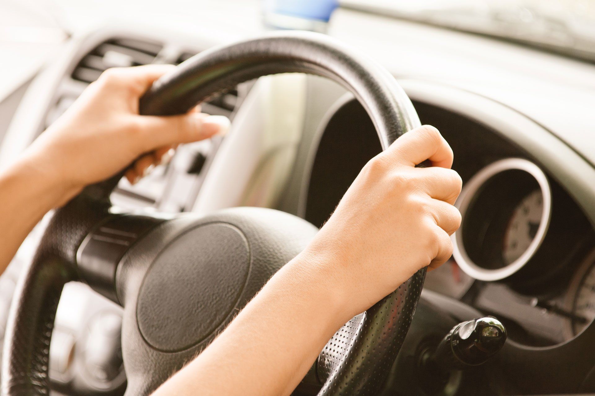 Steering wheel being handled by female driver