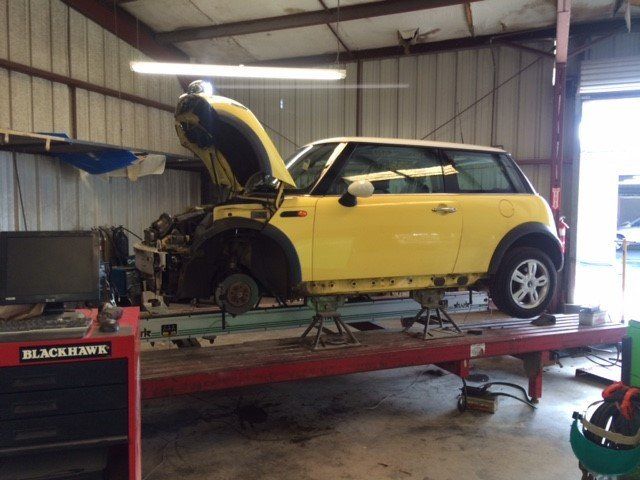Professional checking the wheel alignment in Hilo, HI