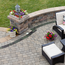 An aerial view of a patio with chairs and flowers