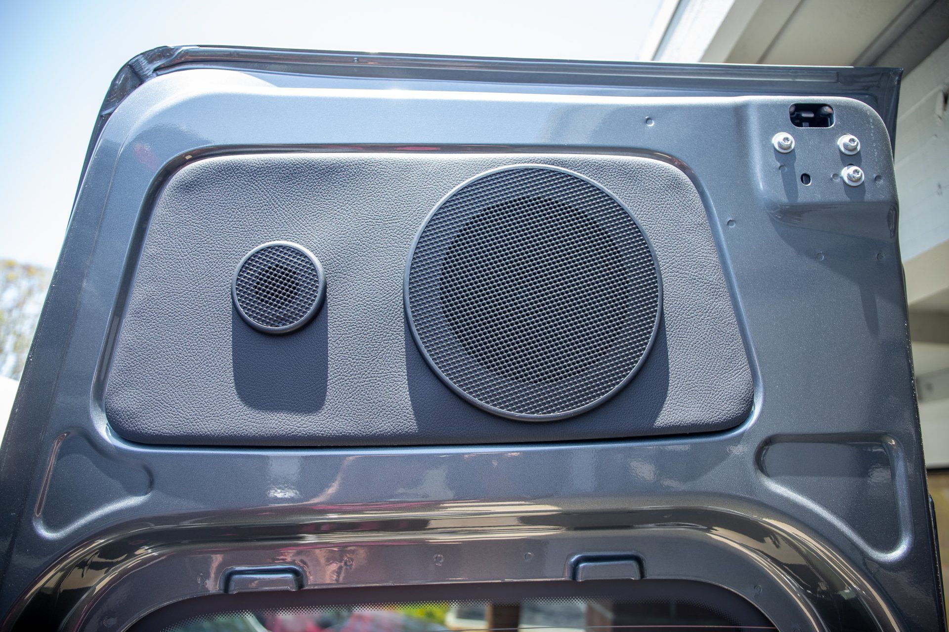 a close up of a speaker on the back of a car .