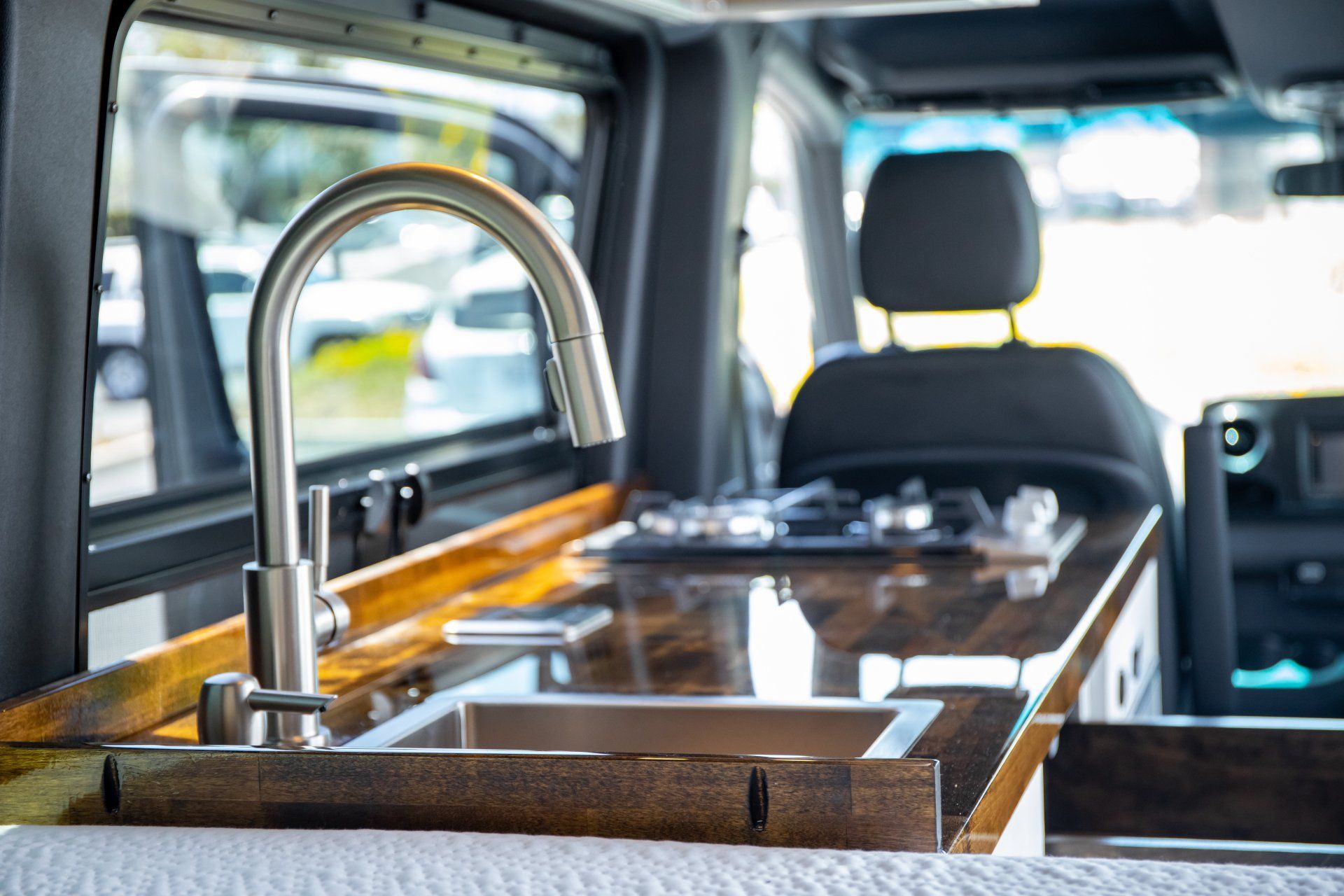 a kitchen sink in the back of a van .