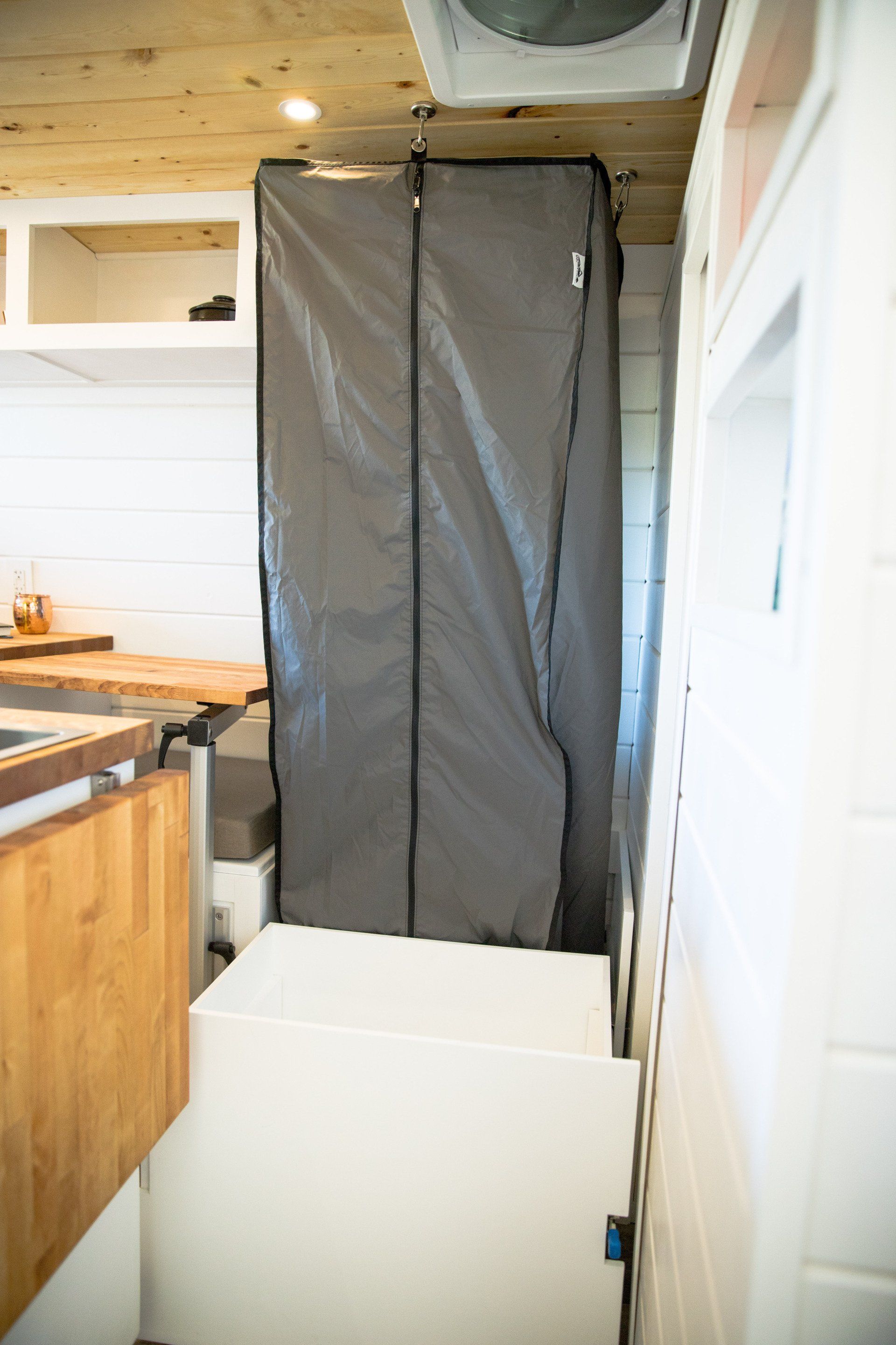 a bathroom with a shower stall and a fan on the ceiling .