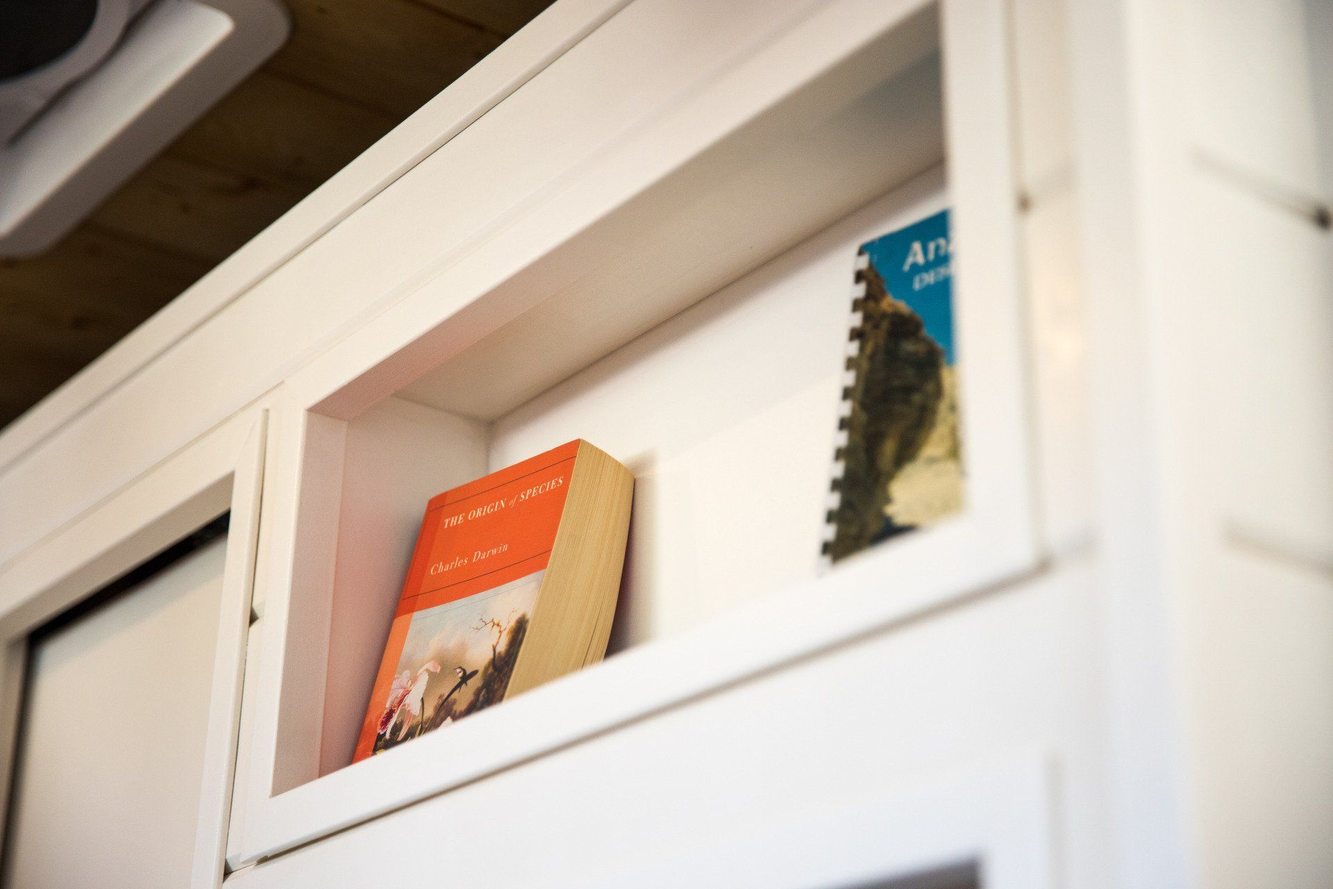 a book is sitting on a shelf next to another book