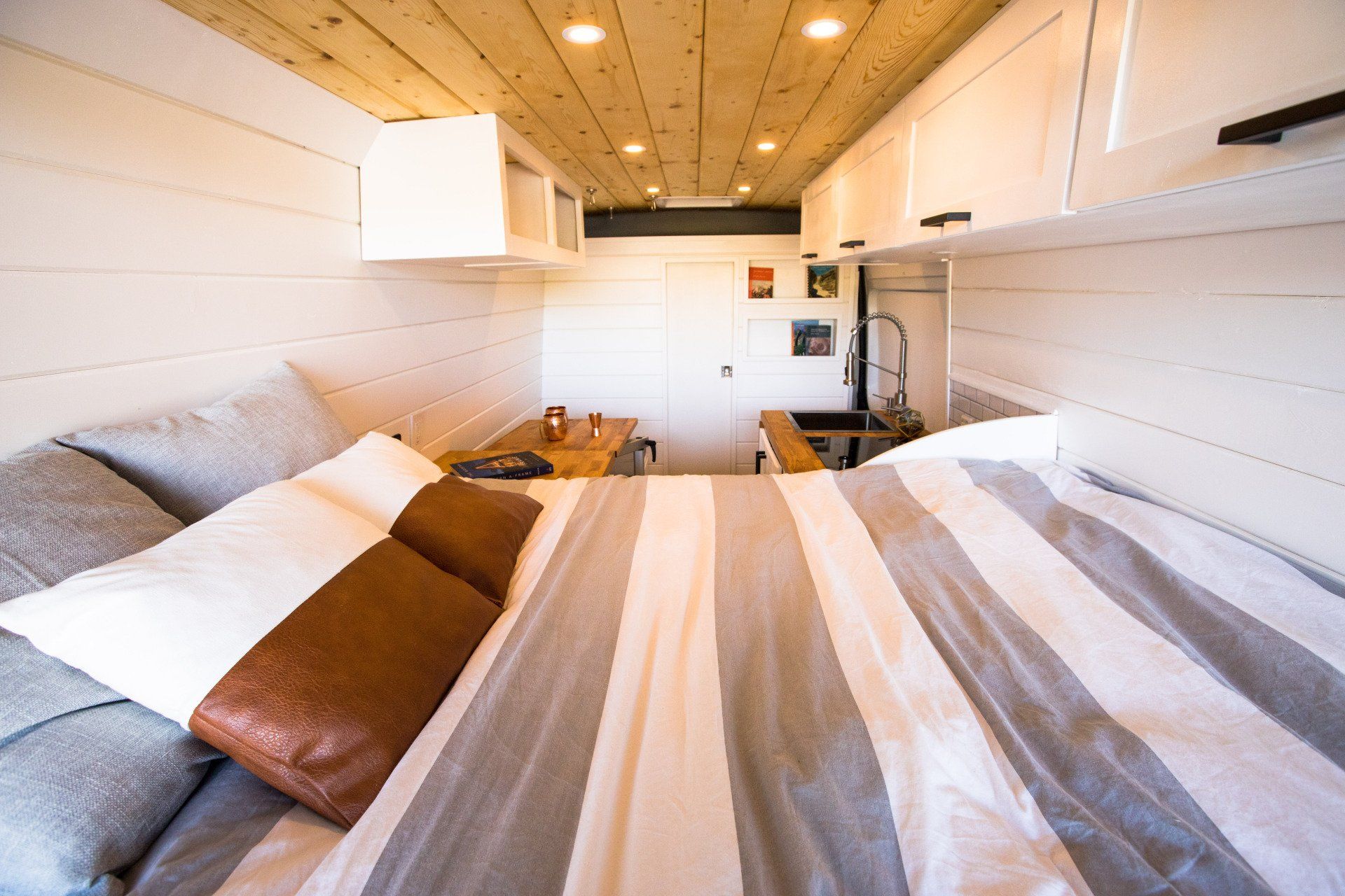there is a bed in the middle of the room .