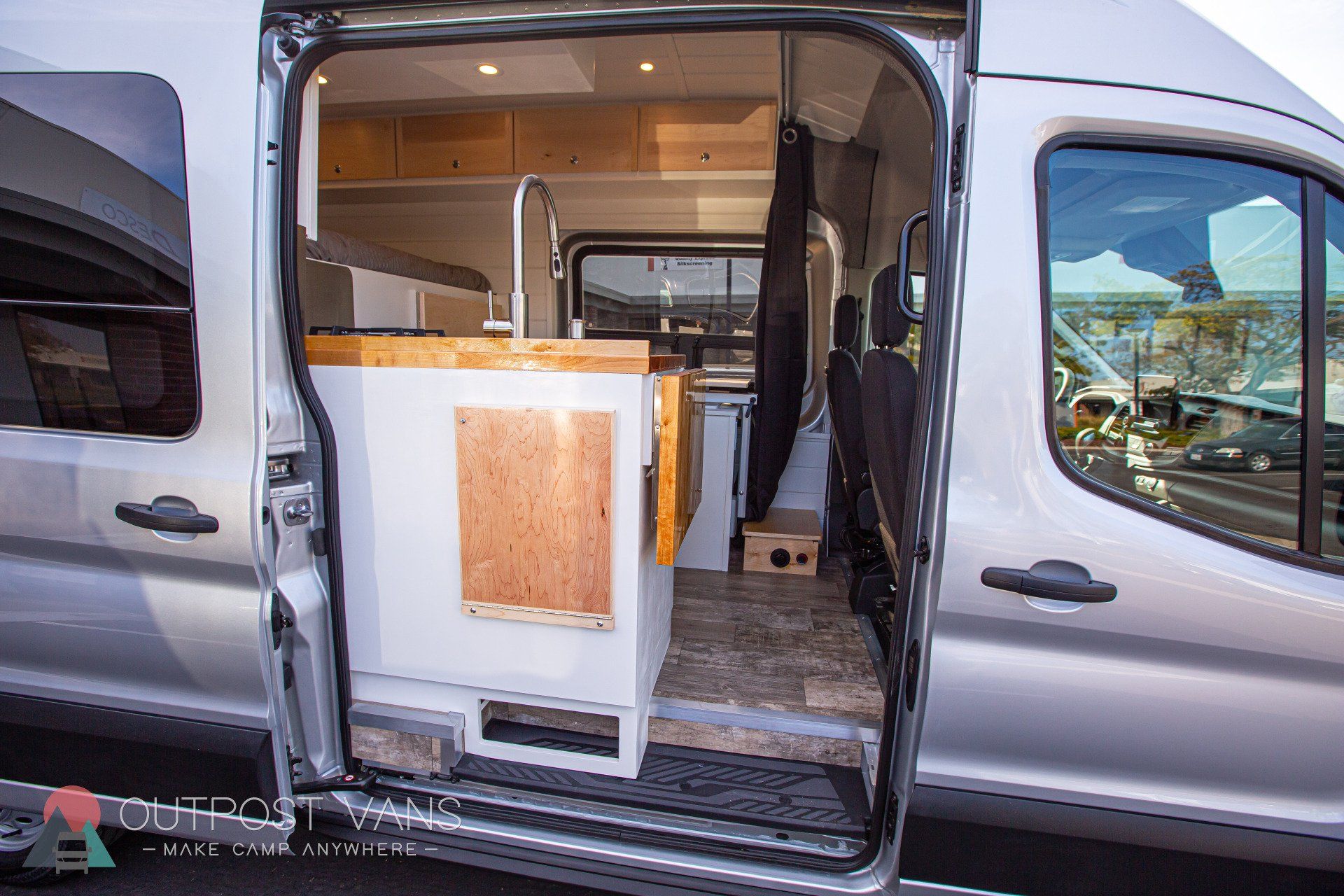 the back of a camper van with the door open .