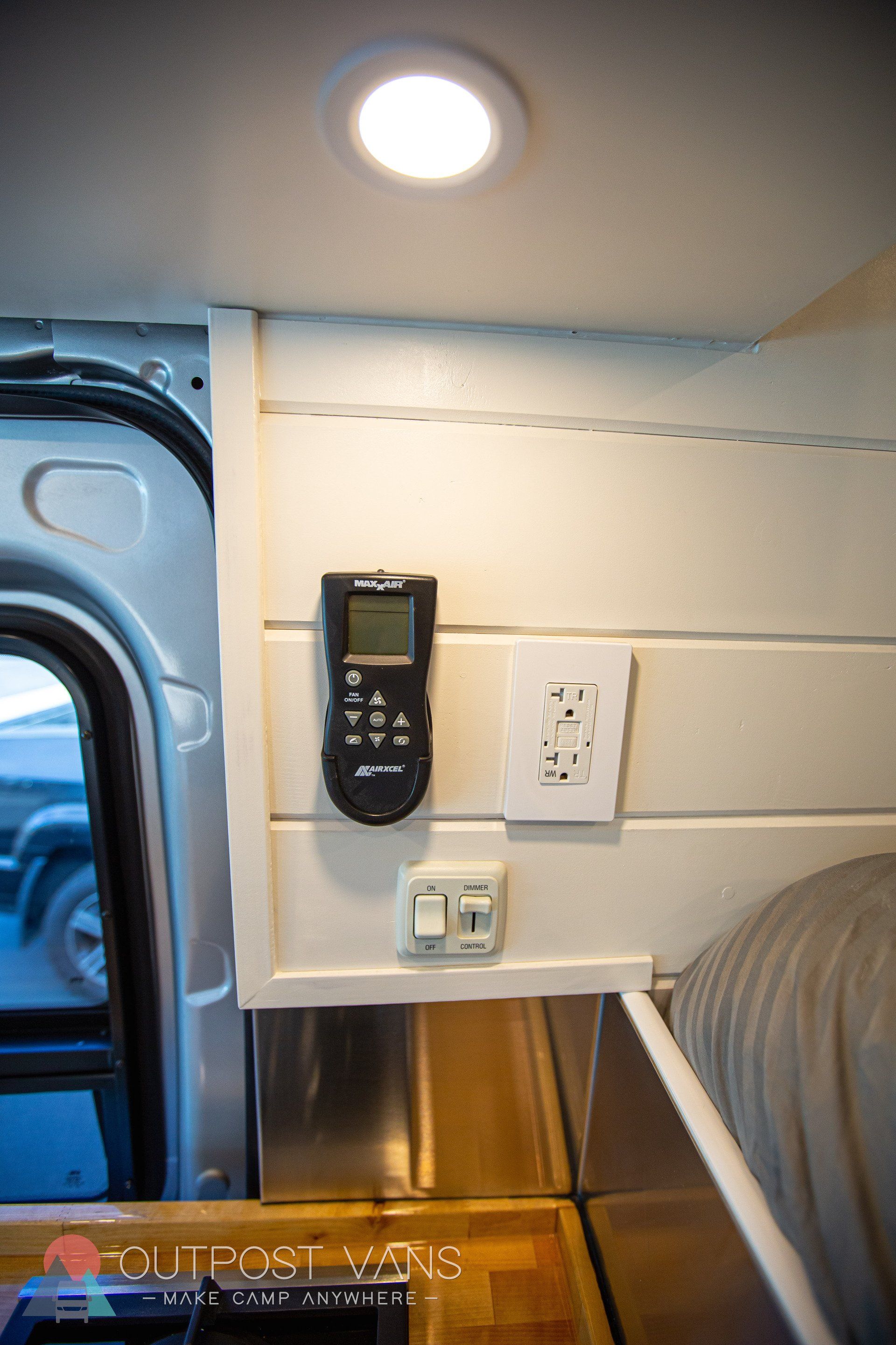 a remote control is hanging on the wall of a van .