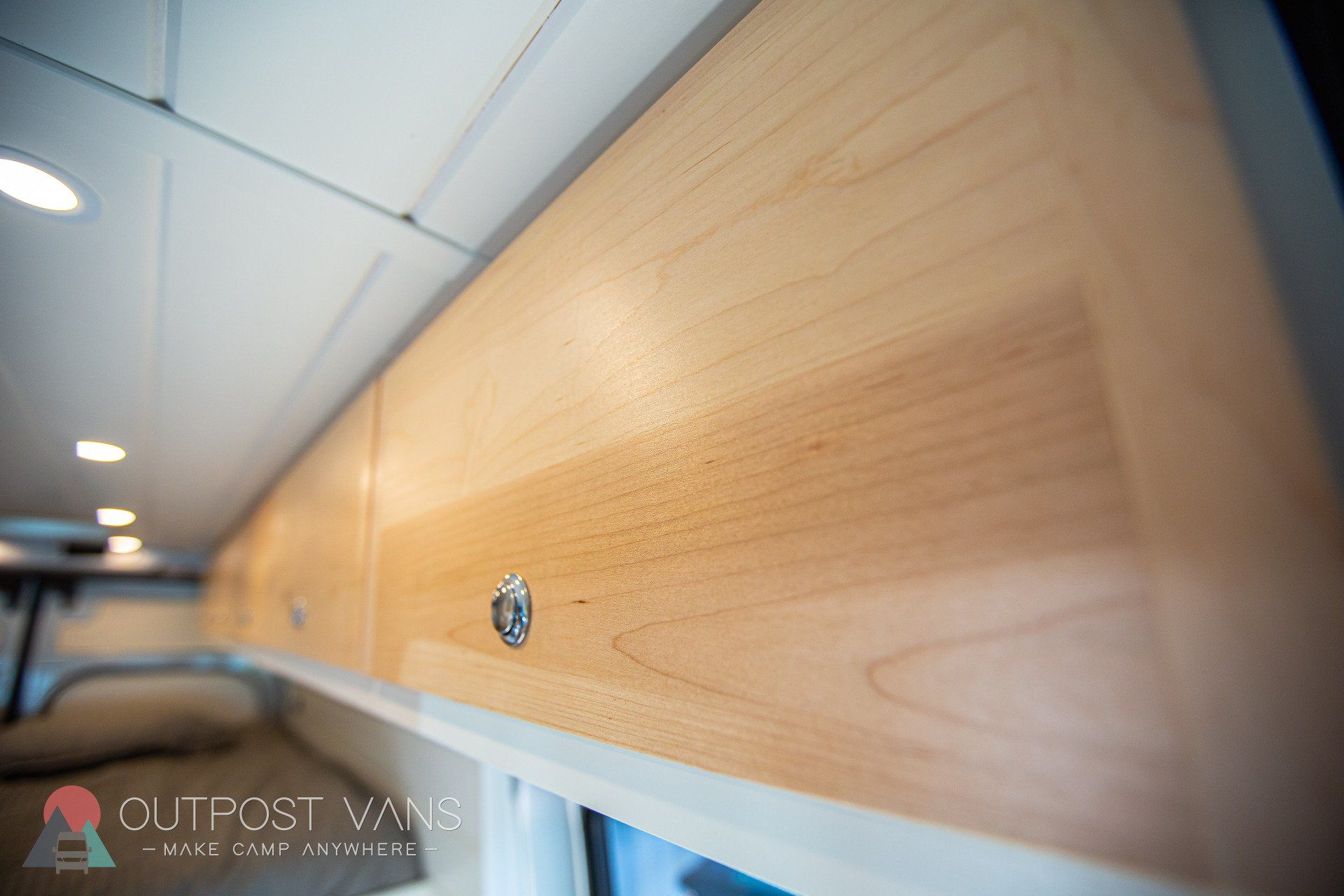 a close up of a wooden cabinet in a van