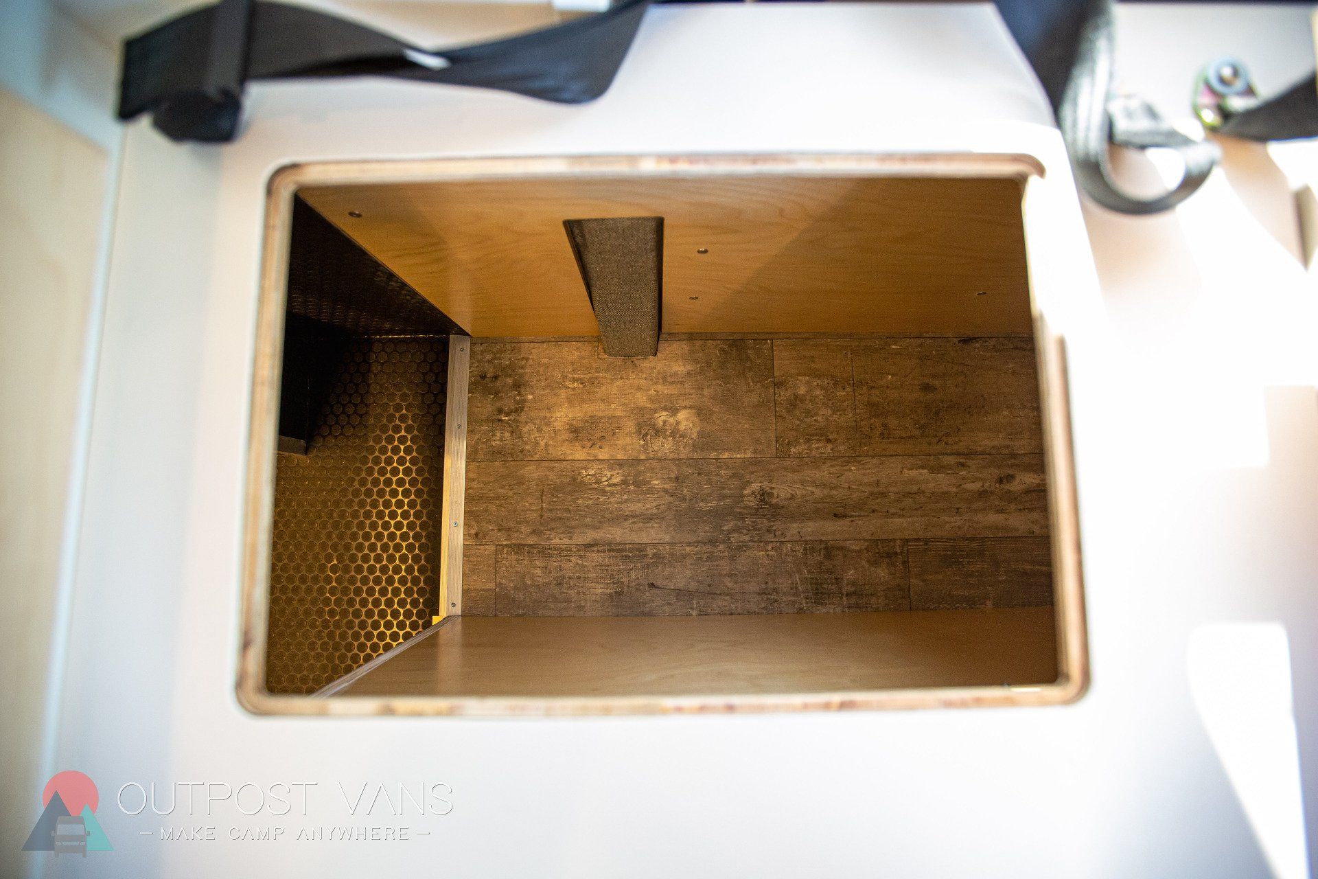 the inside of a white box with a hole in it .