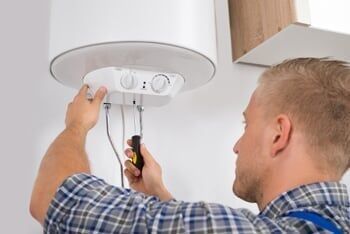 Worker fixing electric boiler